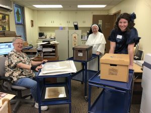 Sister Gretchen, Sister Michael Ellen, and Natalie in the archives