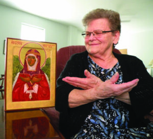 Sr. Linda Schoenborn OP sits with Hesychia, one of her favorite icons. Sr. Linda "wrote' this icon.