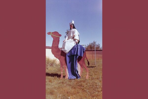 Sister Paschal "riding" one of the camel props from the Christmas program in the early 1960s.