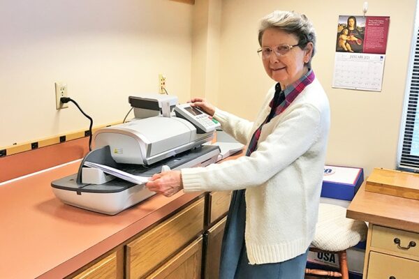 Sr. Peter Mary preparing mail to run through the “Magic” Post Machine!