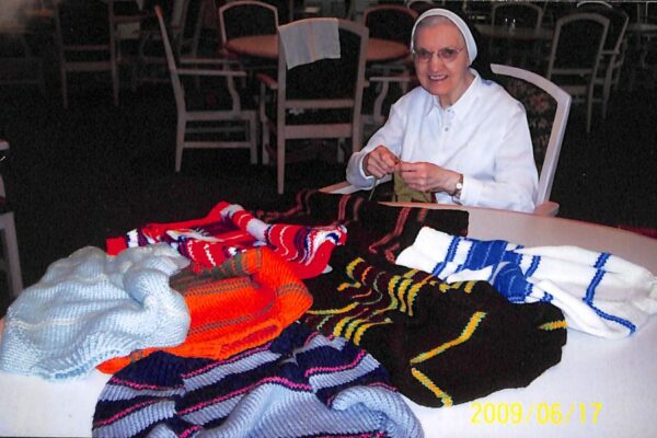 Sister Beata knitting sweaters