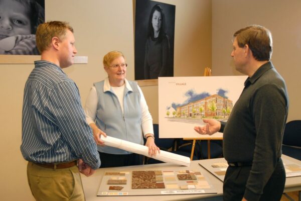 Sister Jarrett along with her colleagues, Denny Sturtevant and Scott Page, review and continue to create plans for the renovation of 30-unit Senior Apartments in Holland, Michigan.