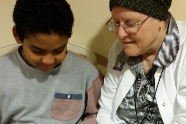 Sister Phyllis Supancheck tutoring in reading.