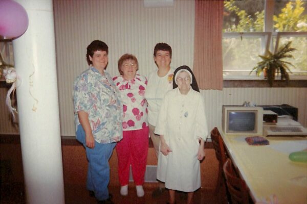 Sister Dominica's farewell party with Sister Julia Nellett, Sister Julia Kroulx, Sister Dominica Nellett and Sister Vivian Keating from left to right in 1989
