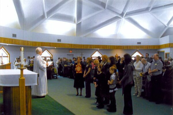 Sister Elaine leads the people in prayer at St. Francis Xavier Parish in Otisville, Michigan.
