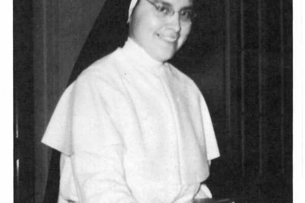 Sr Ellen Mary Lopez was featured in the 1968 Marywood Academy yearbook setting the table in the dining room.