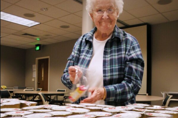 Sister Janet Mish helps prepare lunches for Kids Food Basket, a favorite ministry of the Congregation.