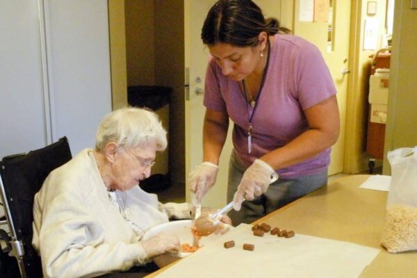 Sister Margaret helps Rachel Romero make snacks for the other Sisters at Marywood Health Center.