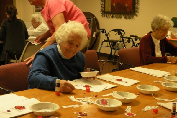 The Dominican Sisters are strong supporters of Kids Food Basket in Grand Rapids. Sister Thomas Estelle Bryan adds her creative touches to bags.