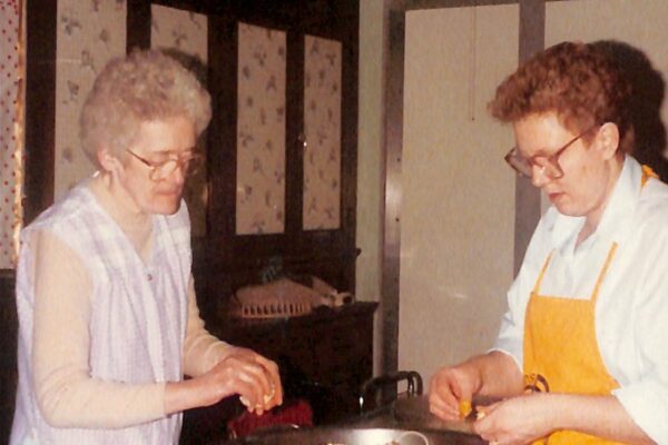Sister Eunice Cronin on the left and Sister Rose on the right preparing food