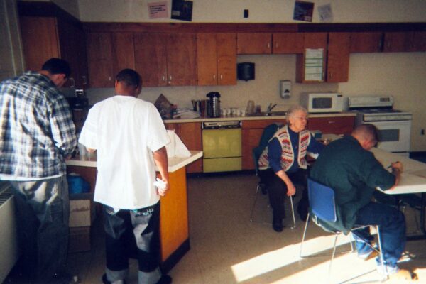 Sister Mary Louise Stauder tutoring men in jail to earn their GED.