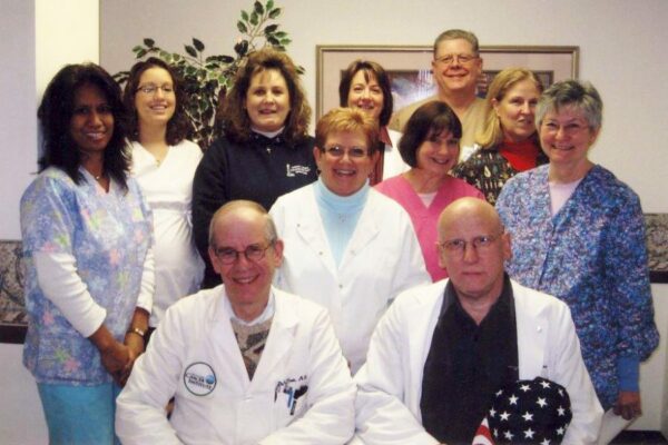 Sr. Roxane (far right) with fellow staff at the office of Drs. Cook and Abrahamson in Bay City