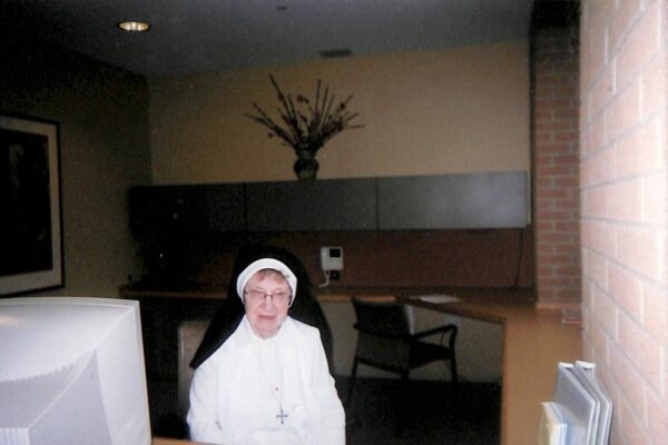 Sister Rosalita working at the front desk