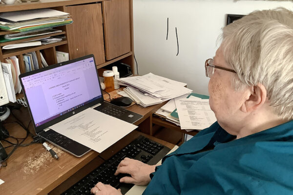 Sr. Maria Carla prepares an agenda for the steering committee at the Lansing Area Parkinson’s Support Service where she also volunteers.
