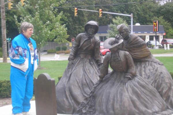 Syvia Wozniak OP visits a war monument and prays with the war widows.