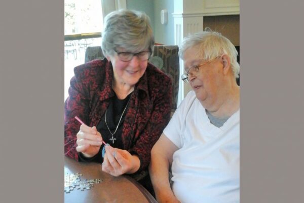 Sr. Joan shows a new crochet stitch to Frances, one of her regulars whom she visits with often as part of her ministry.