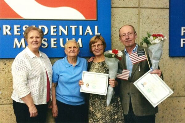 Sisters Carmen and Janice (left) with two of their students after they were sworn in as United States citizens.