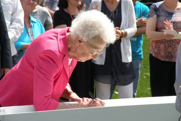 Aquina Weber signing beam Aquinas College 2018