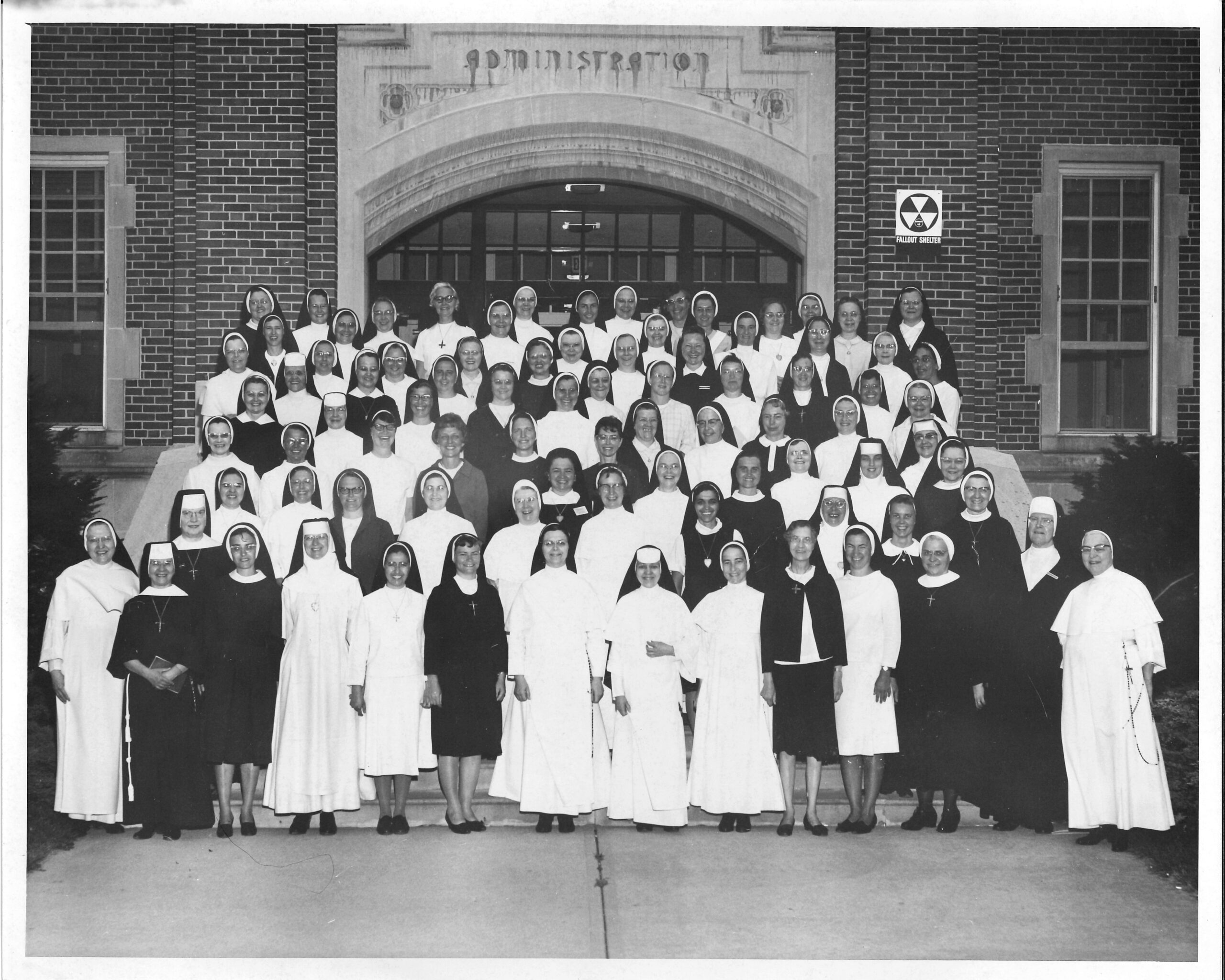 Prioress Sister Aquinas Weber, seventh from left front row, stands with Sisters at Aquinas College in 1968.